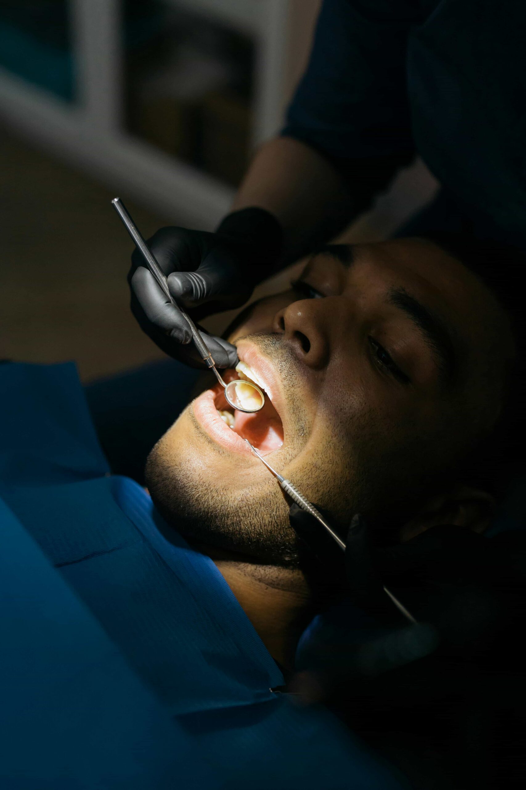 checking teeth for plaque buildup
