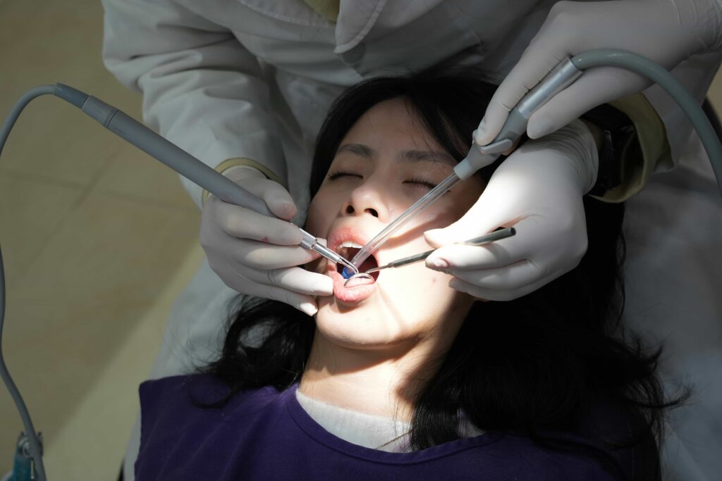 cleaning plaque off of girls teeth