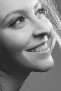 black and white photo of woman smiling